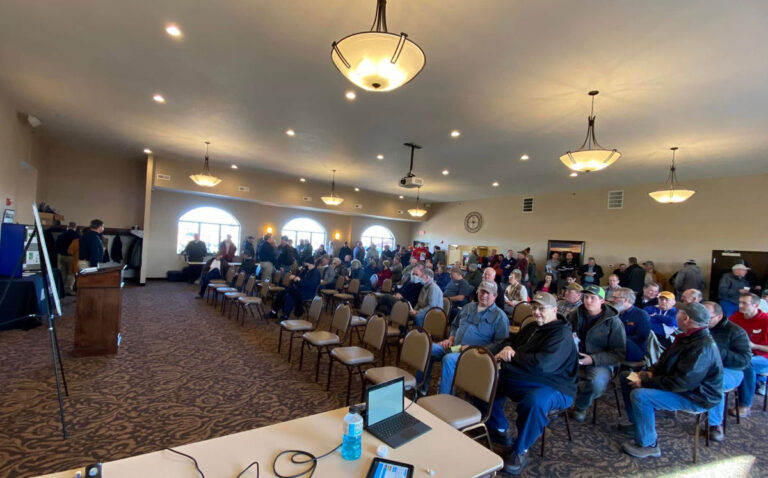 Absolute auction of northwest Iowa farmland with bidders in attendance